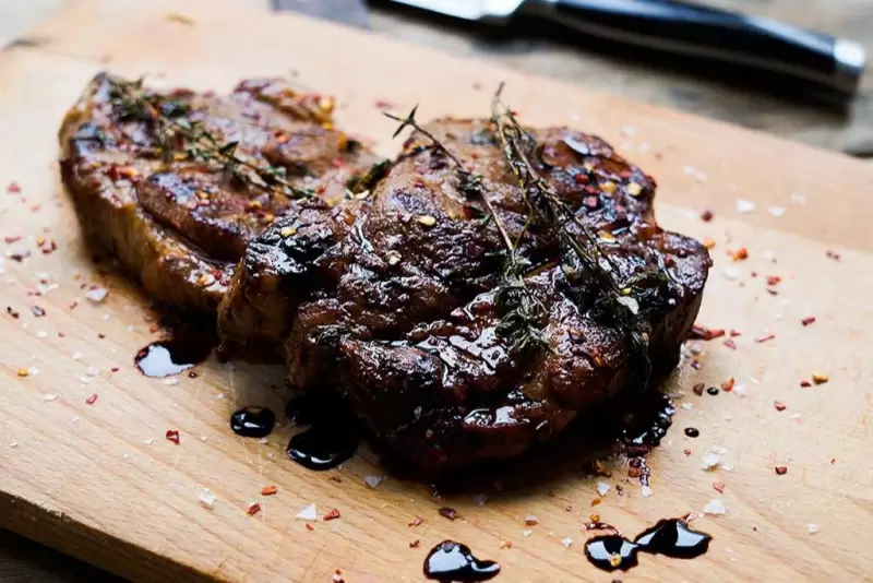 Grilled pork loin steaks with honey and ginger marinade