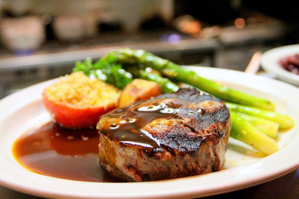 Image of lucious, cooked rib eye steak